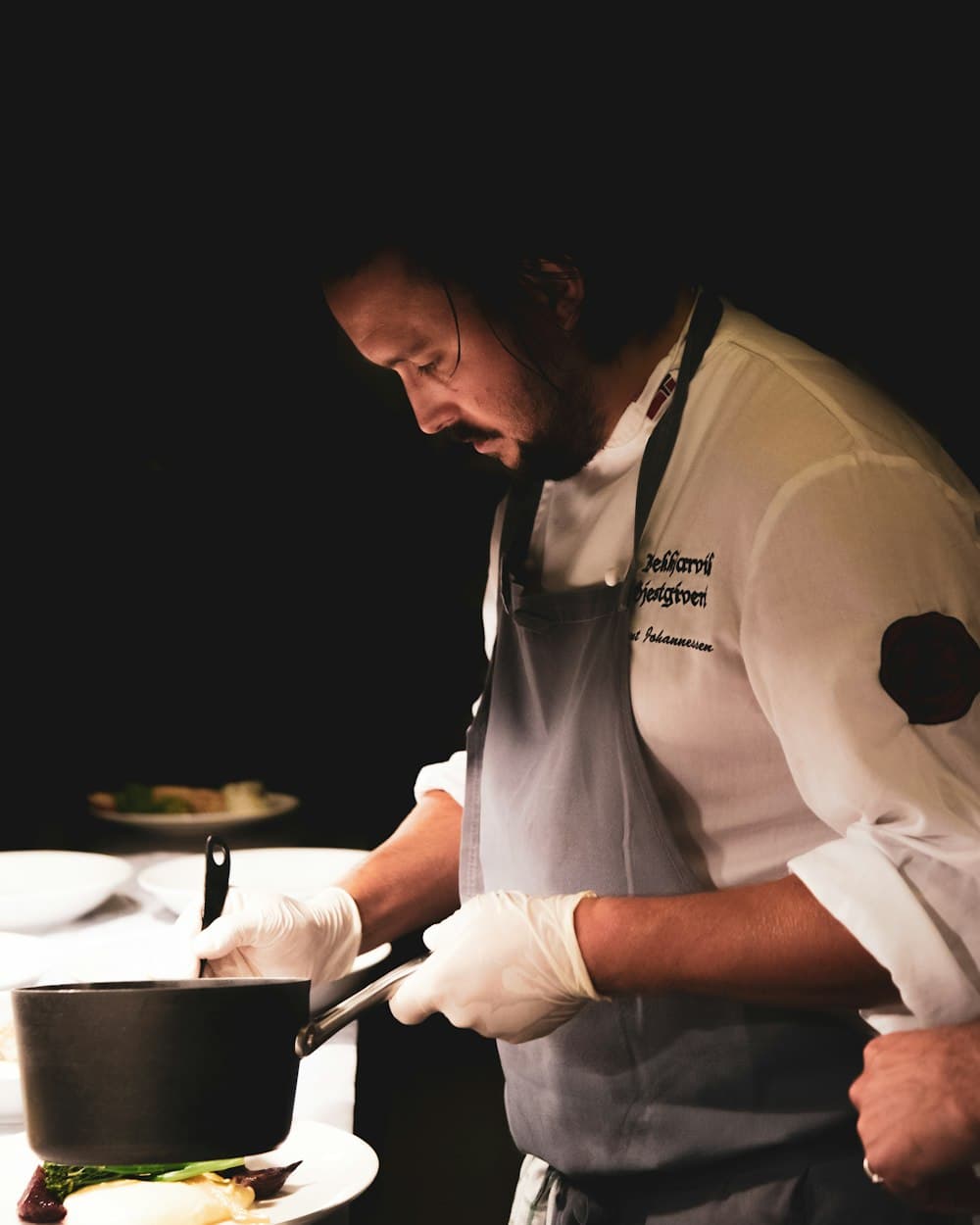 A cook working the line during prep.